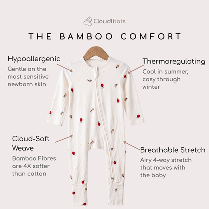 An off-white baby bamboo sleepsuit with a front zipper and small red bug prints, shown on a hanger against a light beige background with text callouts highlighting features like hypoallergenic comfort, thermoregulating properties, Cloud-Soft Weave, and breathable stretch. The brand name 'Cloudlitots' is visible at the top.