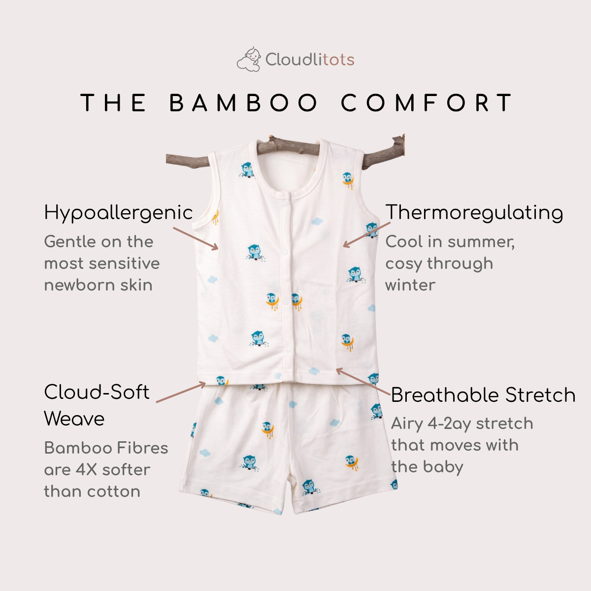 A baby bamboo jabla and shorts set shown on a light beige background with marketing text callouts. The set includes a white sleeveless top and matching shorts printed with small blue and yellow owl cartoon motifs.