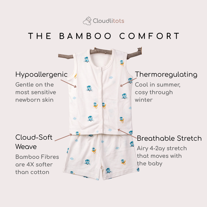 A baby bamboo jabla and shorts set shown on a light beige background with marketing text callouts. The set includes a white sleeveless top and matching shorts printed with small blue and yellow owl cartoon motifs.